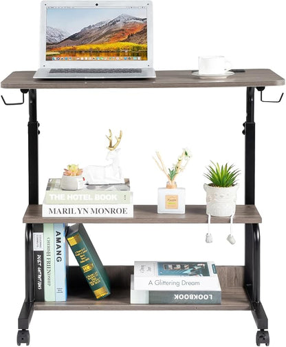 Karl home 31.5" Portable Rolling Desk on Wheels,Height Adjustable Standing Desk with 2 AC Outlets/3 USB Ports,Mobile Laptop Table with Hooks and Storage Shelves for Home Office，Grey Oak