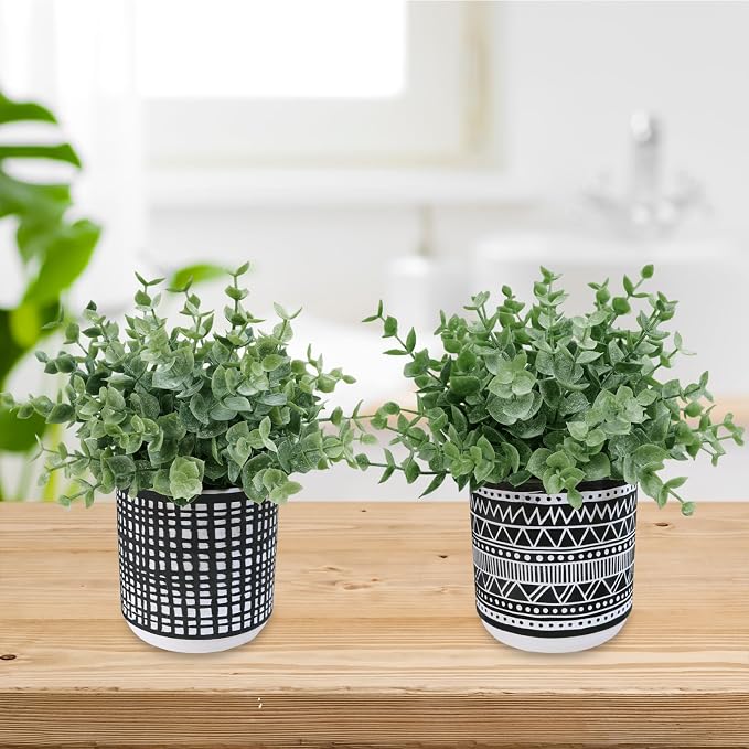 Winlyn Set of 2 Small Potted Plants Artificial Eucalyptus Plant in Black Geometric Ceramic Pots Faux Potted Greenery 7.1" Tall for Desktop Modern Home Office Living Room Kitchen Table Decorations