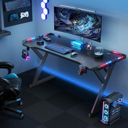 HLDIRECT 55 Inch Gaming Desk with LED Lights, Ergonomic Computer Gaming Table with Carbon Fibre Surface, Sturdy PC Workstation Desk for Home Office with Headphone Hook, Cup Holder, Black