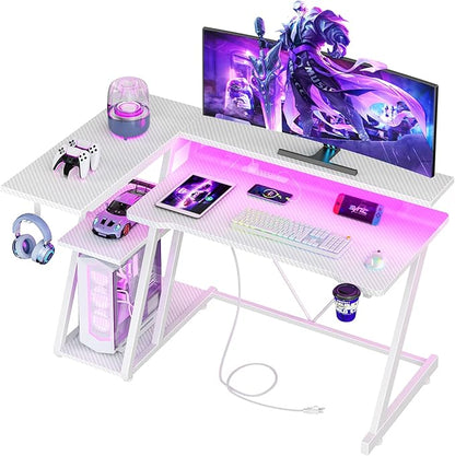 Korfile 40 Inch Gaming Desk with Power Outlet & LED Lights, L Shaped Computer Gaming Table with 3 Tiers Storage Shelves, Corner Gamer Desk with Monitor Stand for Small Space, Carbon Fiber White