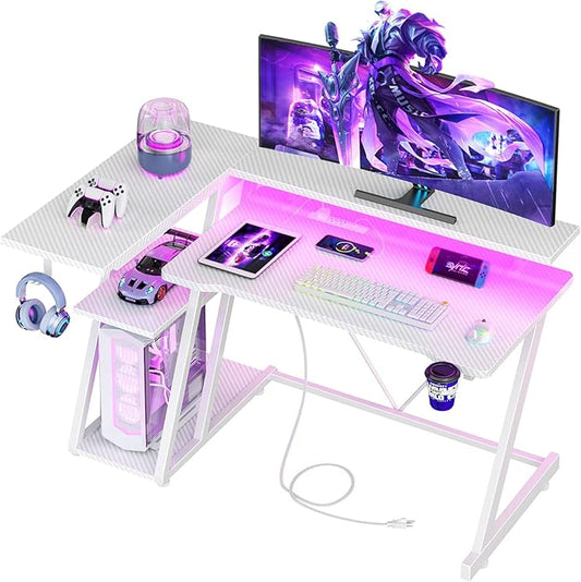 Korfile 40 Inch Gaming Desk with Power Outlet & LED Lights, L Shaped Computer Gaming Table with 3 Tiers Storage Shelves, Corner Gamer Desk with Monitor Stand for Small Space, Carbon Fiber White