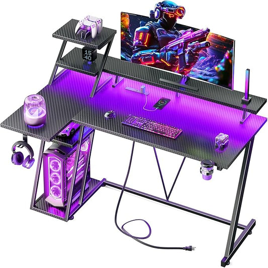 Korfile 55 Inch Black Gaming Desk with LED Lights & Power Outlet, Gaming Computer Desk with Storage Shelves, L Shaped Gamer Workstations with Monitor Stand for Bedroom